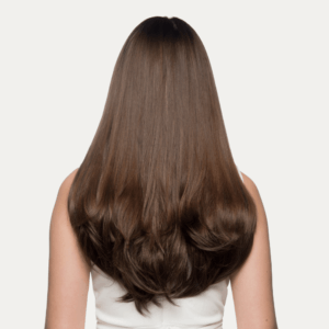 Back view of 20” One piece flicky clip-in hair In brunette colour on pretty girl
